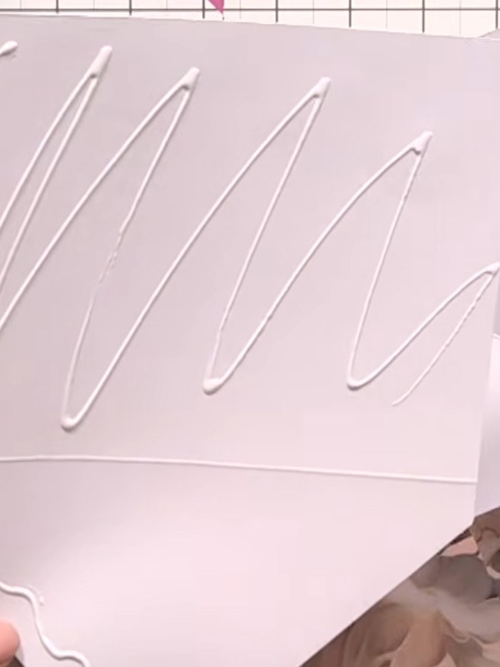 Step 6: Glue the liner inside the main envelope, ensuring the score lines align beautifully. Position the liner carefu