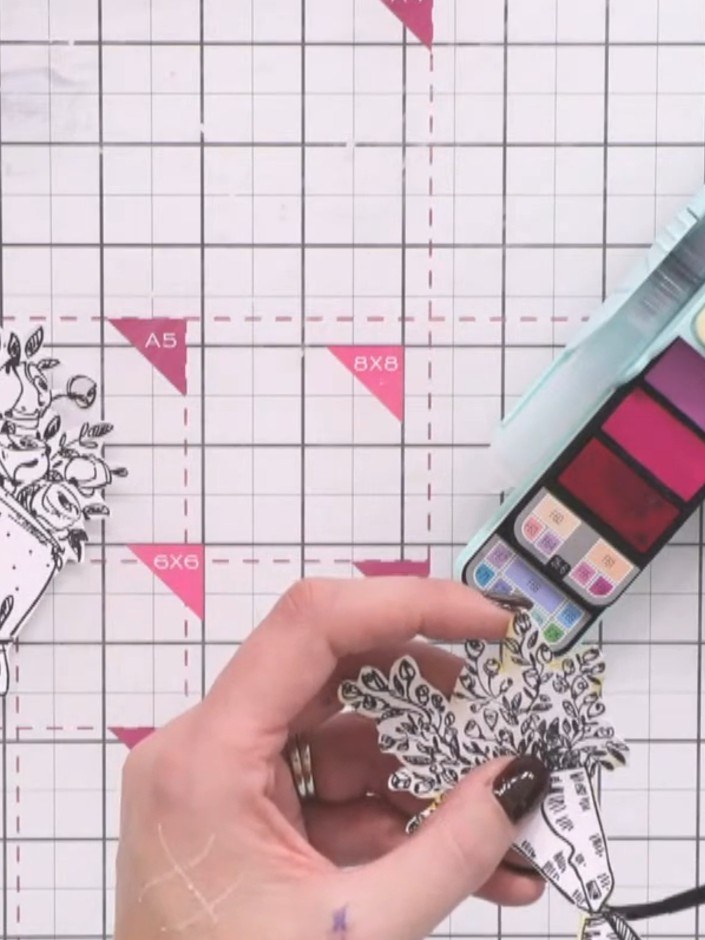 Passo 4: Using a brush, pounce bright watercolour paint onto the flower heads of the stamped image. Build up the colour