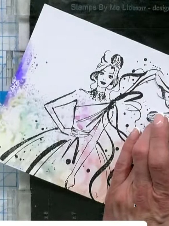 Passo 7: Using a clean, damp brush, add a glitter wash or iridescent effect over the watercoloured areas to create a be