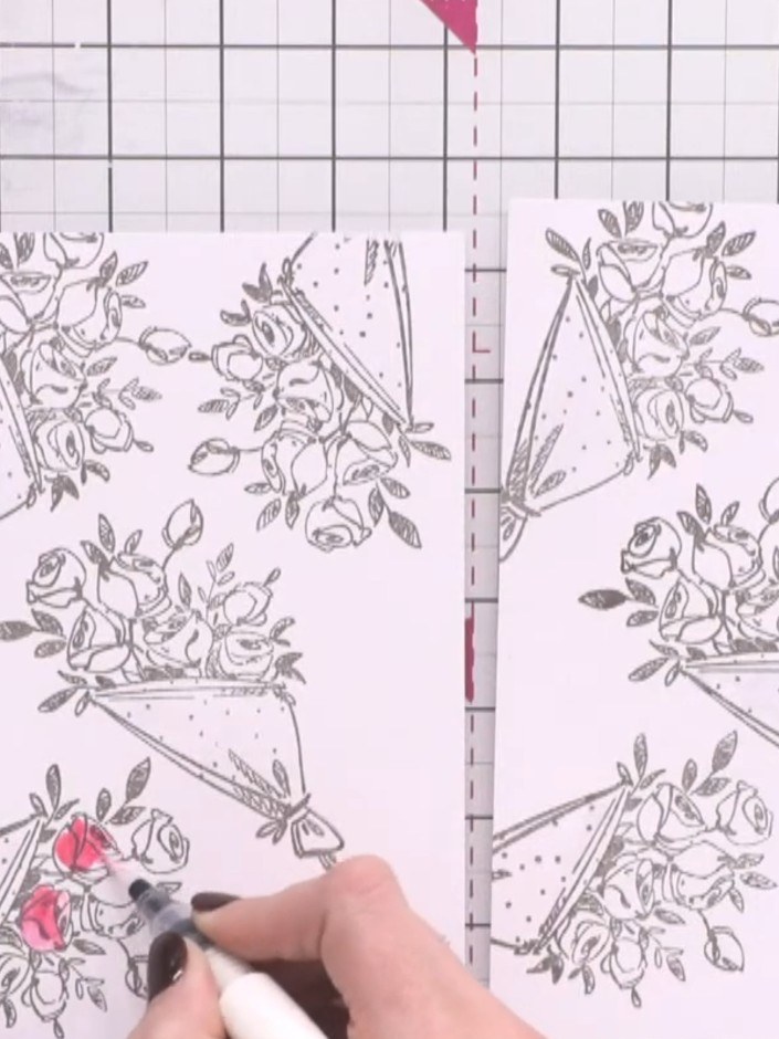 Passo 2: Using a pink sparkle pen, colour three of the roses on the first card. Select individual blooms to colour rath