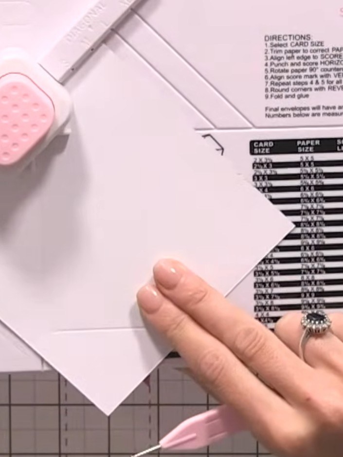 Step 6: Rotate the card once more and align with the score line 2. Punch and score the final line to complete the enve