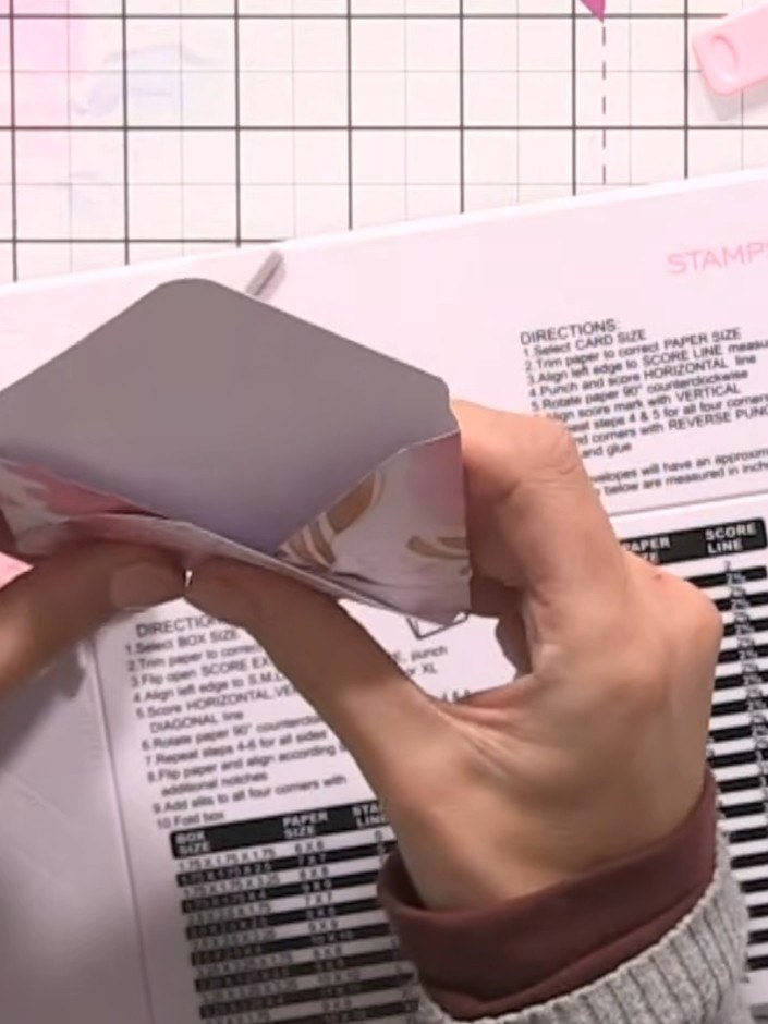 Step 8: Use the corner punch to round off the corners of the envelope flap.