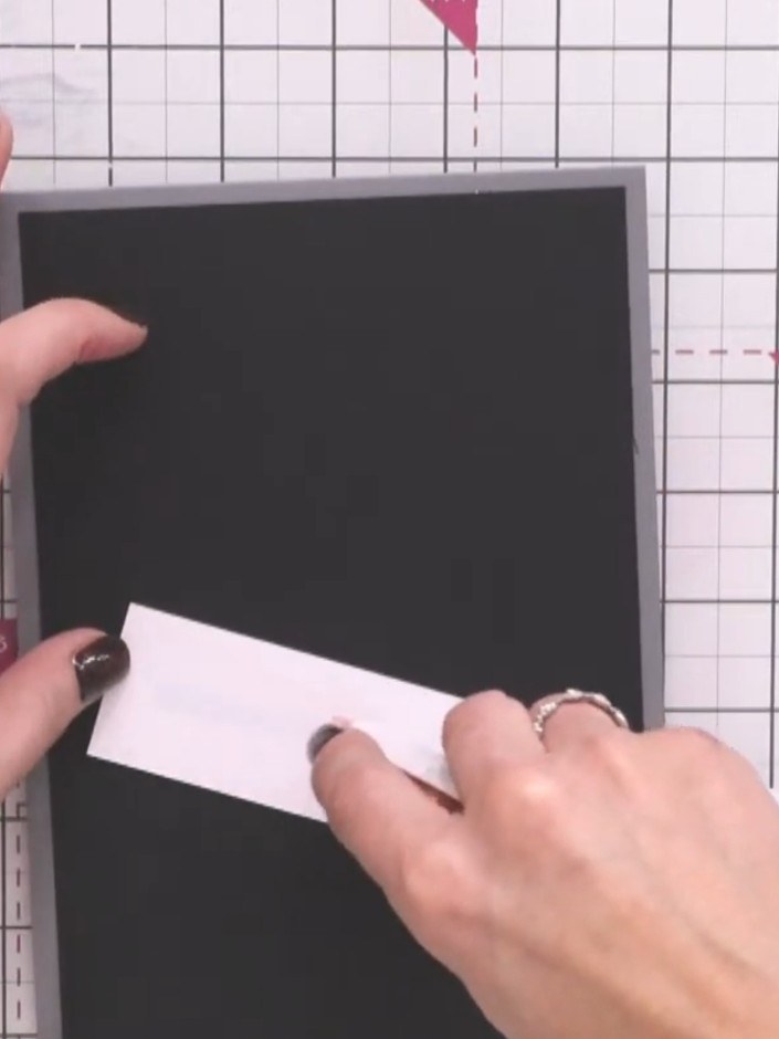 Stap 6: Add your sentiment to the white panel. You can either stamp a 'Thank You' message or use a washi tape sentimen