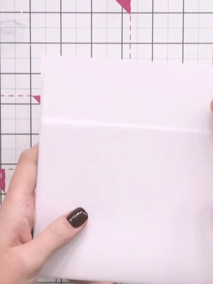 Paso 2: Stamp the lady image from the stamp set onto a white cardstock panel using black ink, positioning her centrall