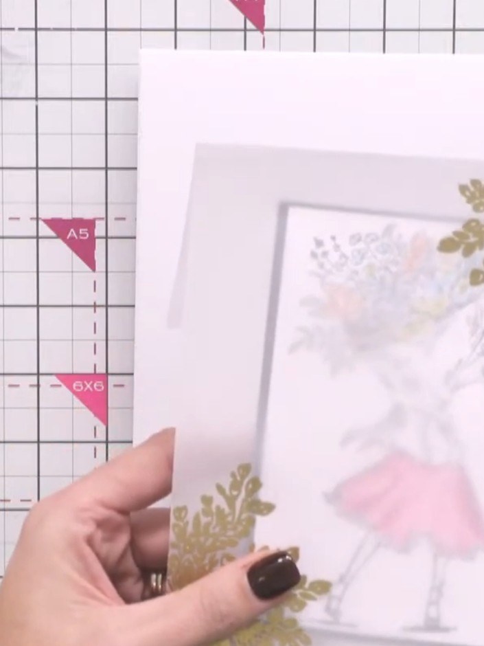 Paso 7: Adhere the coloured vellum overlay to the front of your card base using glue dots or tape positioned along the