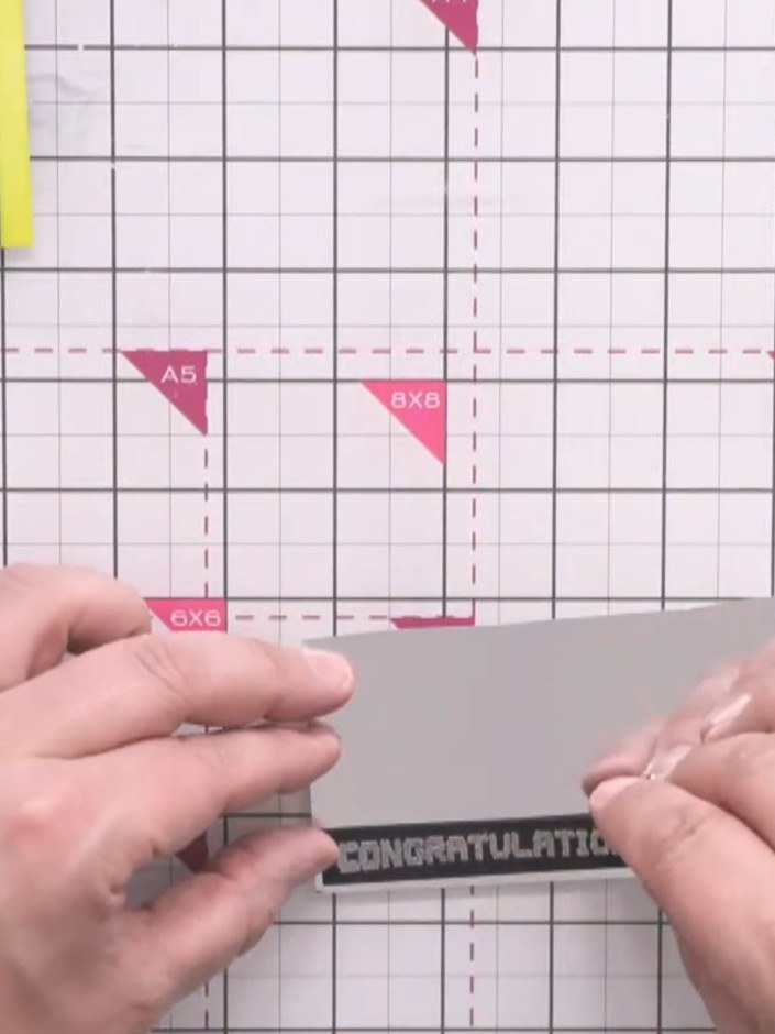 Passo 13: Trim the embossed 'CONGRATULATIONS' sentiment and mount it onto mirror board to add shine. Position the mounte