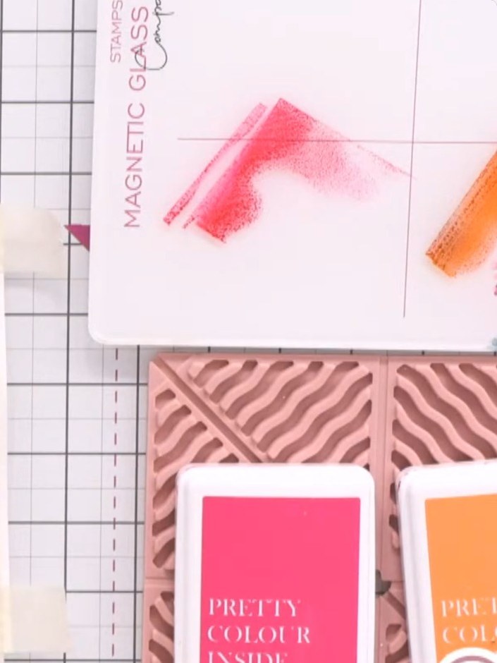 Passo 3: Apply orange ink pad colour to the masked area on your card. Add pink or magenta colour over the orange, allow