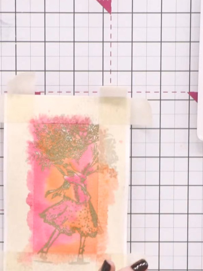 Passo 6: Take the magenta ink pad and add colour details to the stamped image, focusing on areas like the flowers and c