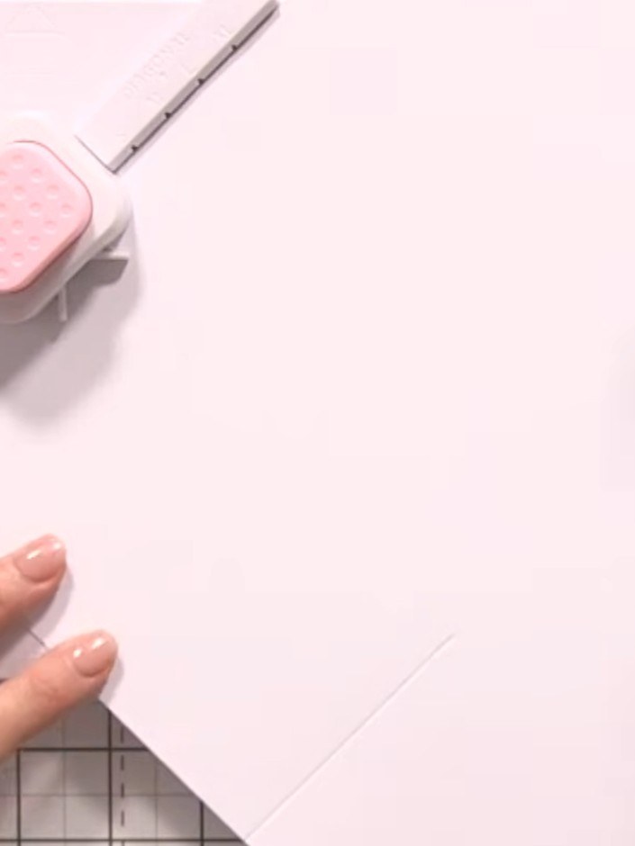 Step 3: Rotate the card 90 degrees. Score again from the XL start line to the point, creating a second score line perp
