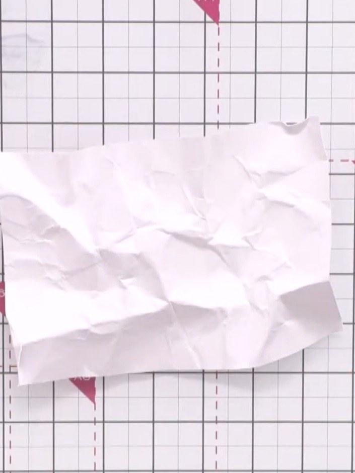 Step 1: Start with a piece of white card approximately 7 by 5 inches. Scrunch and crumple the card to create texture, 