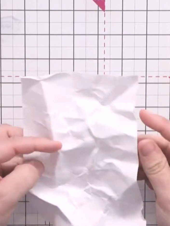 Step 3: Manipulate the scrunched card with your fingers to create deep creases and add texture throughout. Focus on ar