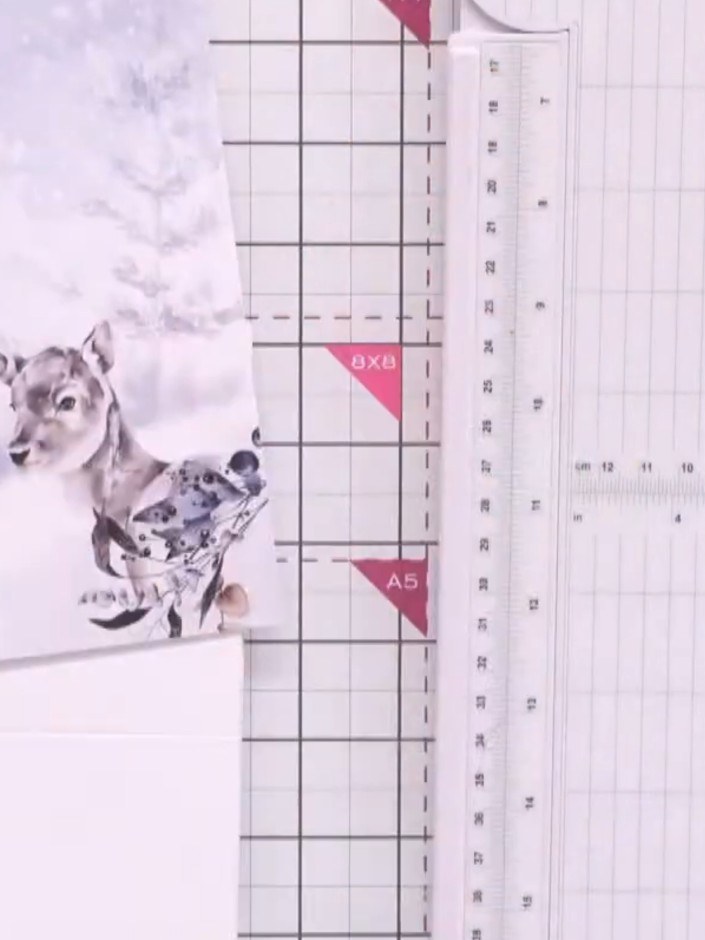 Step 2: Place your chosen patterned paper on the cutting mat. Use your finger as a guide to mark where you want to tri