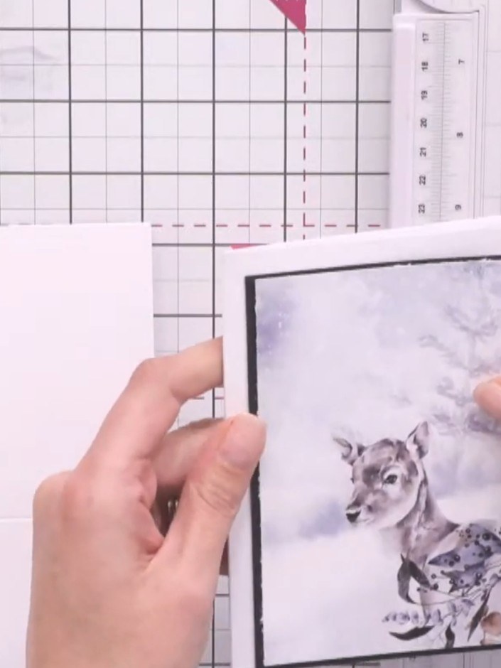 Step 4: Cut a piece of black cardstock to create a mat layer. Position it behind your chosen patterned paper panel to 