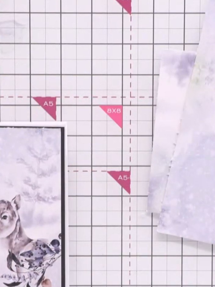 Step 7: Adhere your patterned paper to the black card blank using glue, applying it around the edges. Position the sta