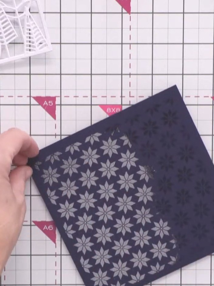 Step 3: Remove the stencil carefully to reveal the inked floral pattern. Heat emboss the design using clear embossing 