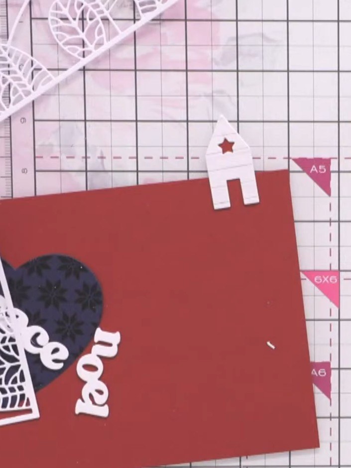 Step 9: Die-cut a festive word from white cardstock and layer it multiple times to create substance. Apply embossing i