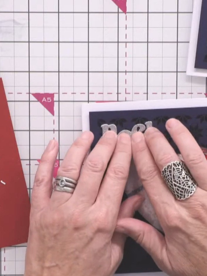 Step 2: Select a contrasting paper from the white magic pad and position it behind the heart aperture to create a back