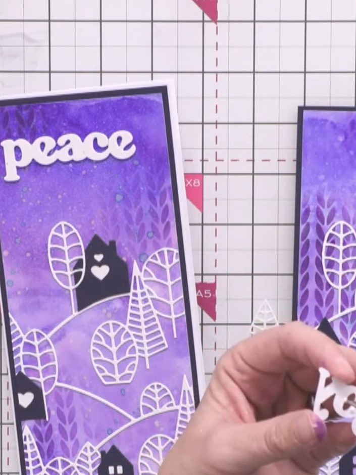 Step 14: Die-cut a festive word such as 'Joy' from white cardstock using the Festive Word Dies. Position and adhere the