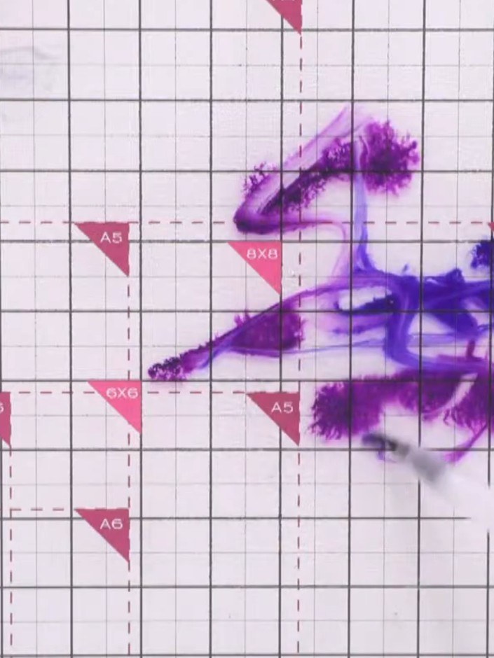 Step 2: Spritz the white cardstock lightly with water using a spray bottle to prepare the surface for ink application.