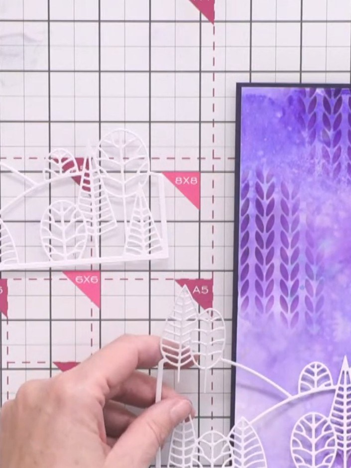 Step 9: Die-cut the country view die from white cardstock three times to create layered hills for your scene.
