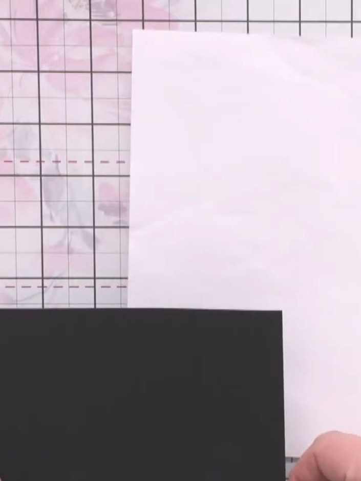 Step 1: Place a piece of scrap paper on your work surface to protect it. Position a square of black card (just under 1