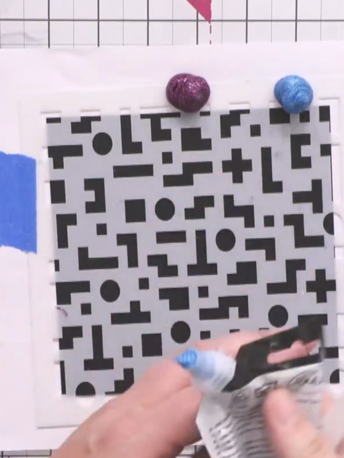 Step 4: Add a blob of Caribbean blue paint to the middle section of the stencil, between the two blue tape markers.