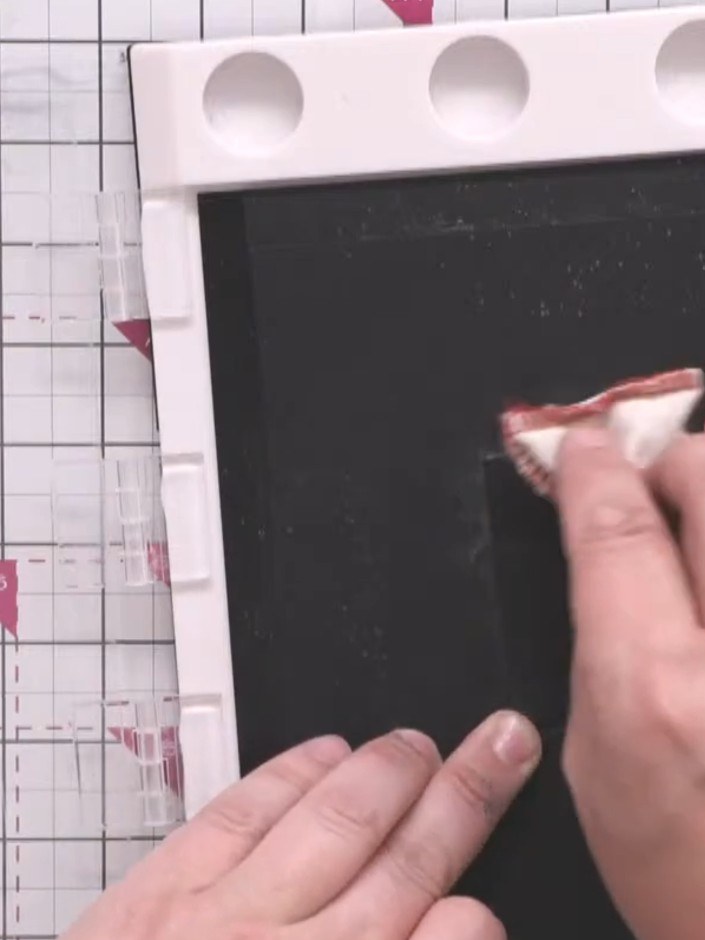 Step 2: Ink the 'Eat Sleep Game Repeat' sentiment stamp with black ink, ensuring full coverage of the design and all a