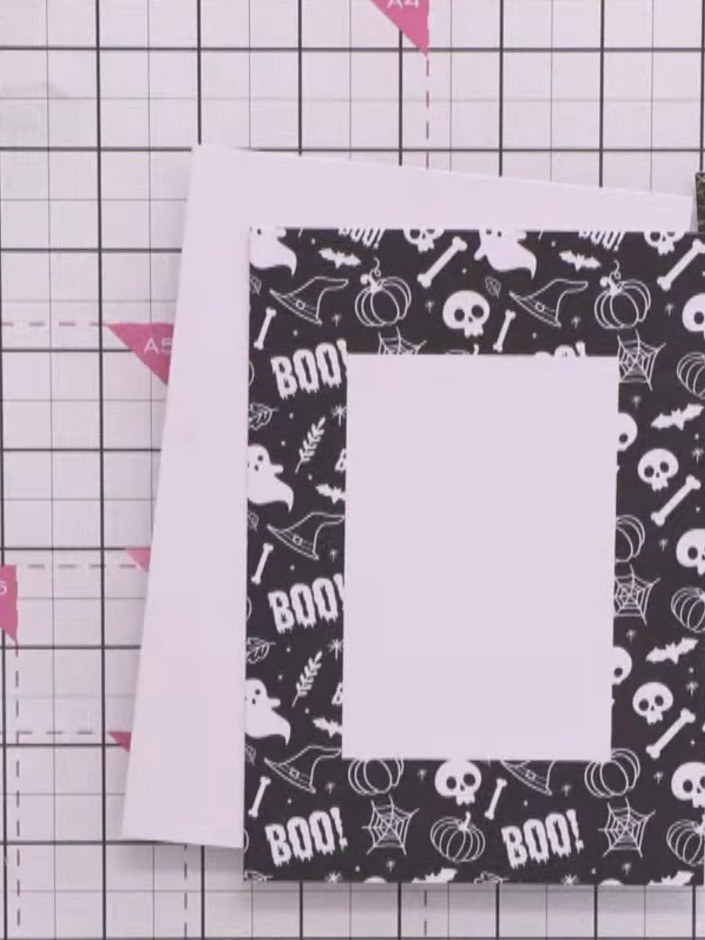Step 4: Adhere the padded topper to the front of the card blank. Position it centrally on the black and white patterne