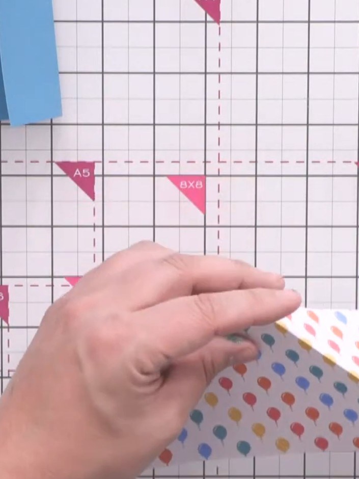 Step 10: Fold the patterned strip inwards along all the creases so that the corners meet in the centre, creating a diam