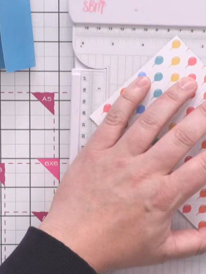 Step 9: Use the bone folder to crease all score lines in both directions to break down the card fibres. Work systemati