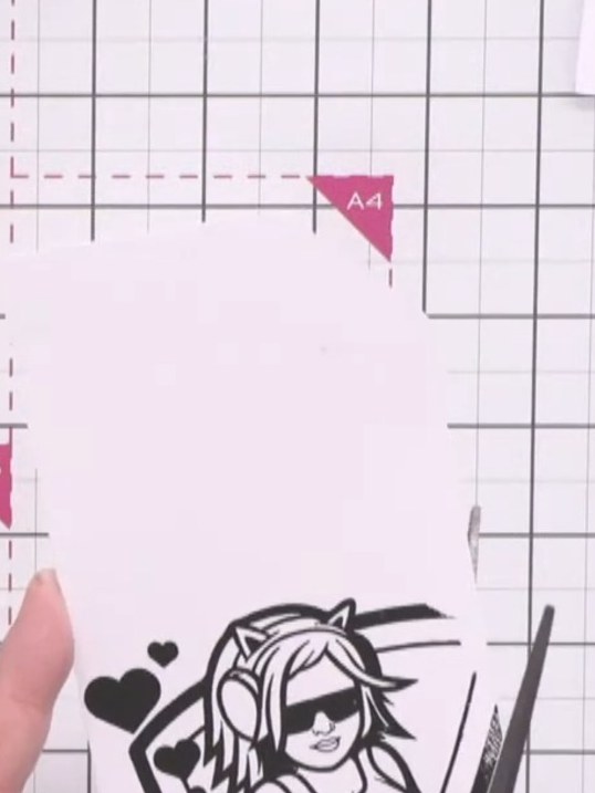 Step 2: Carefully cut around the character outline using scissors, following the black ink edge closely. Cut into the 