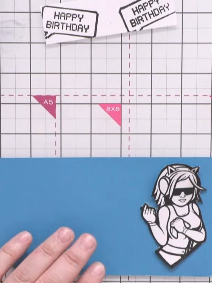Step 3: Cut a slightly larger rectangle from teal card to create a backing layer for your stamped character. Position 