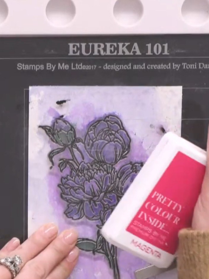 Step 13: Stamp the same outline detail again on top of the black stamped image using pink dye-based ink to add colour v