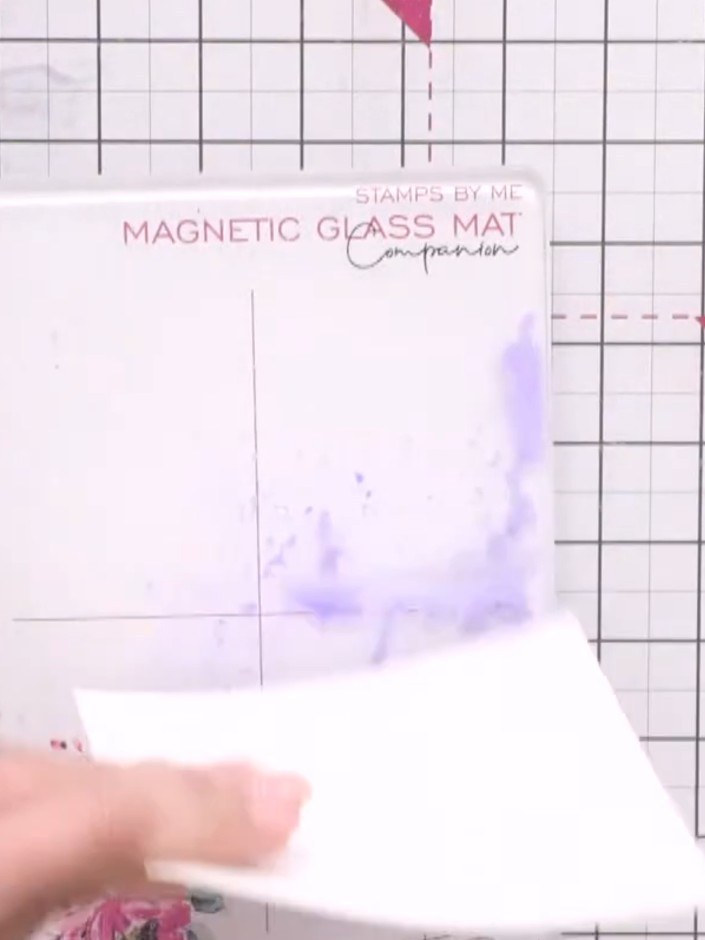 Step 3: Spritz the inked magnetic glass mat with pearly spray water to create a wet, blended effect. Gently move the c
