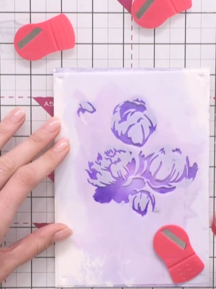 Step 7: Remove the first stencil carefully. Position the second stencil on top of the card, using the numbered alignme