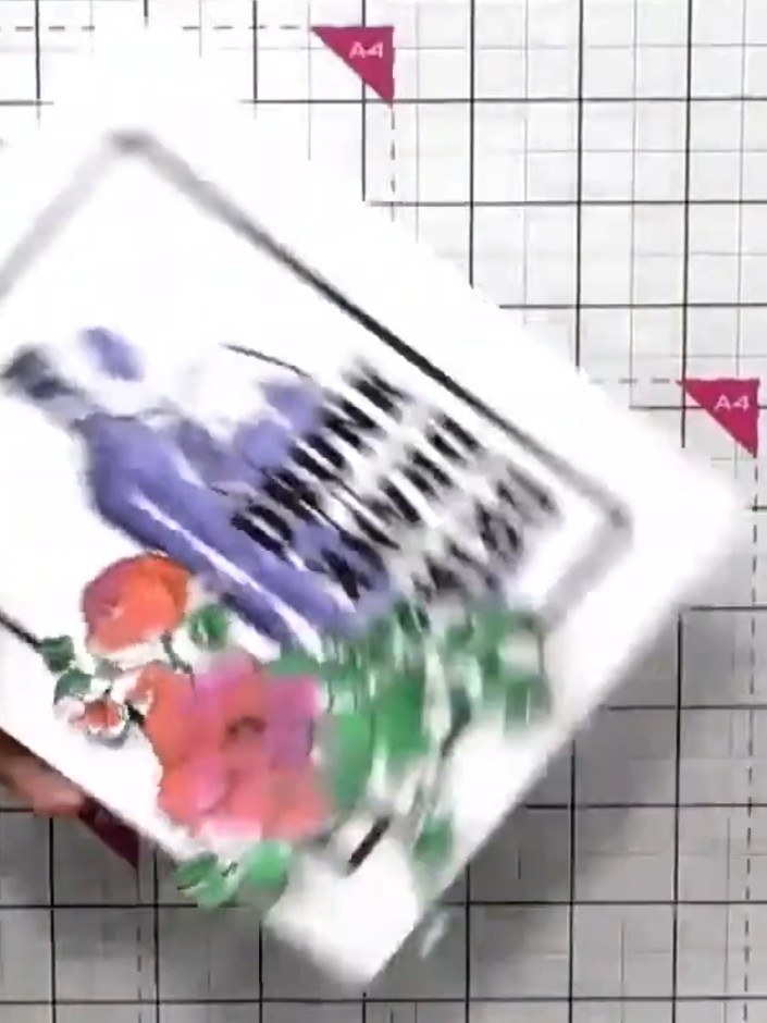 Step 9: Mount the matted design onto your card base. Position it centrally and secure in place with adhesive.