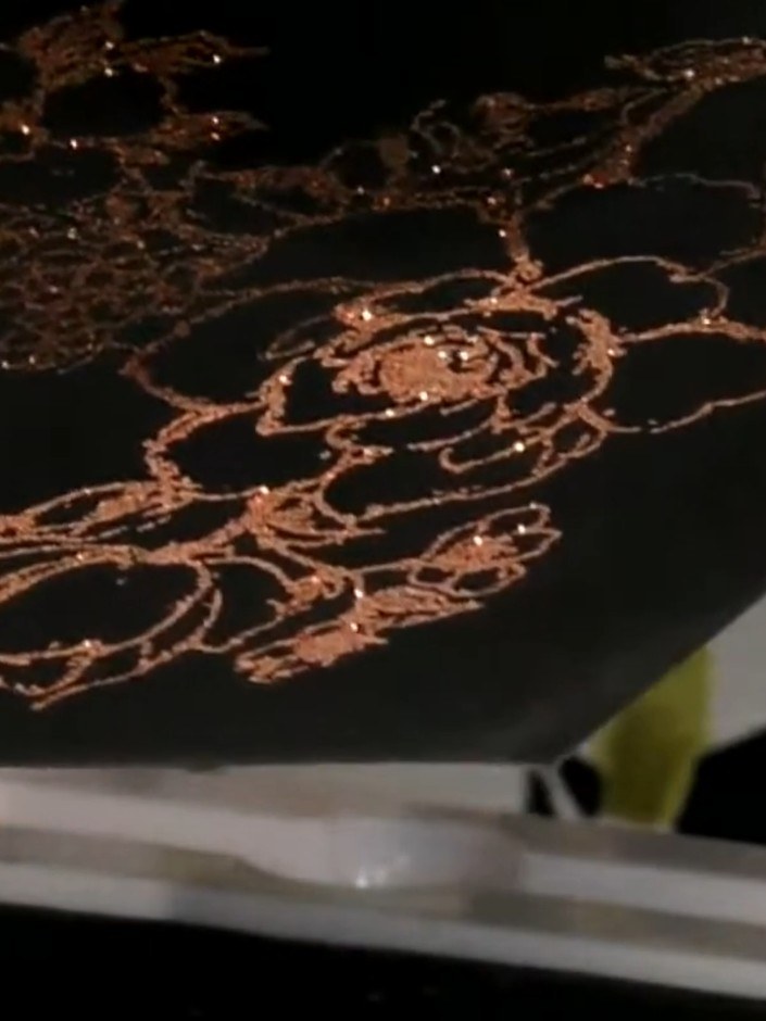 Step 6: Use a white gel pen to add highlights to the embossed iris design, enhancing the details and creating dimensio
