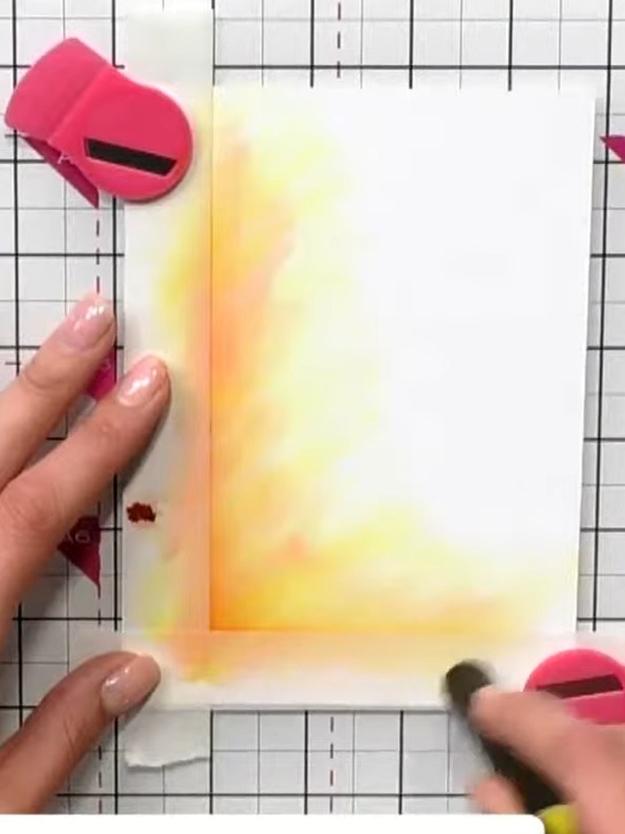 Step 5: Using the blending brushes, pick up the yellow and orange colours from your watercolour background. Apply thes