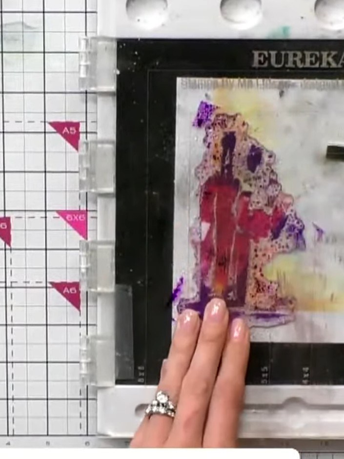 Step 8: Ink the second layer outline stamp in black and carefully stamp it over the first watercoloured layer, alignin