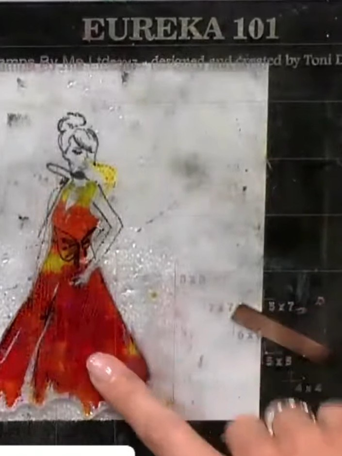 Step 10: Spray the floral stamp with water and stamp it around the gown figure to create a decorative frame. The water 