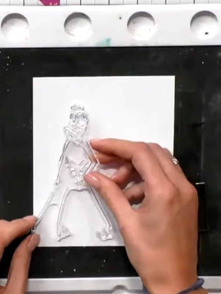 Step 2: Stamp the outline image from the Celebrate Bundle onto white cardstock to create the figure's silhouette. Posi
