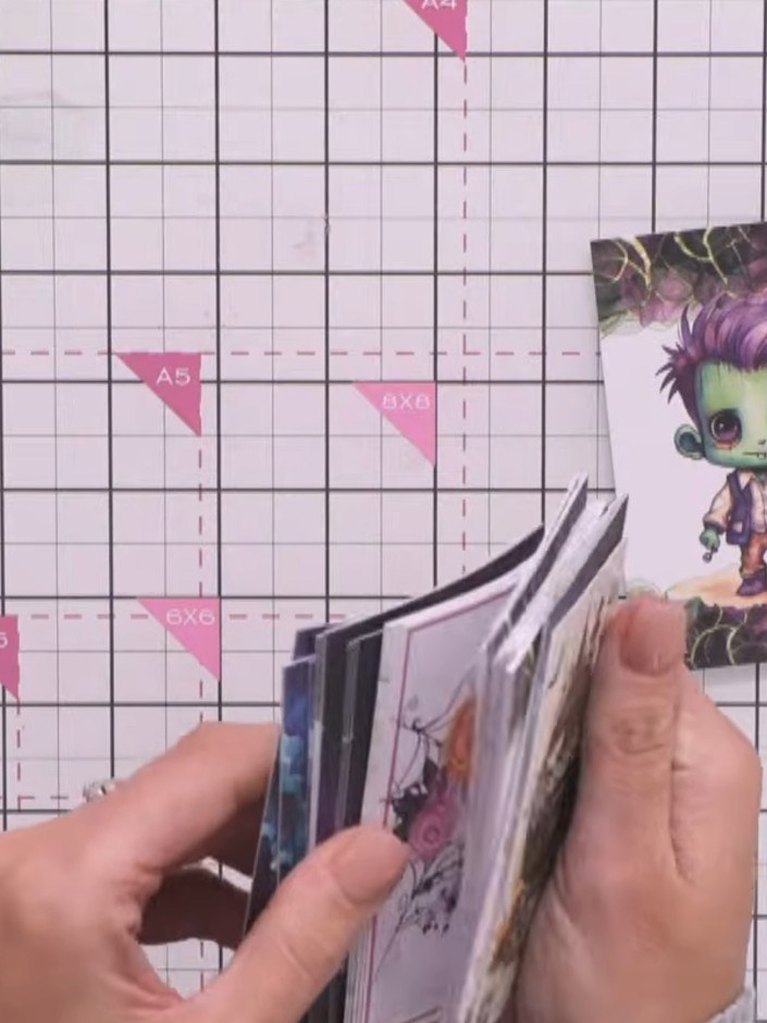 Step 10: Select a character topper from the Bootiful kit. Carefully fussy-cut around the character image, following the