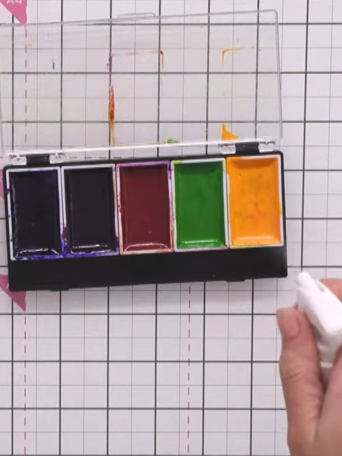 Step 2: Spray your watercolour paints with water to activate them using a water mister or spray bottle.