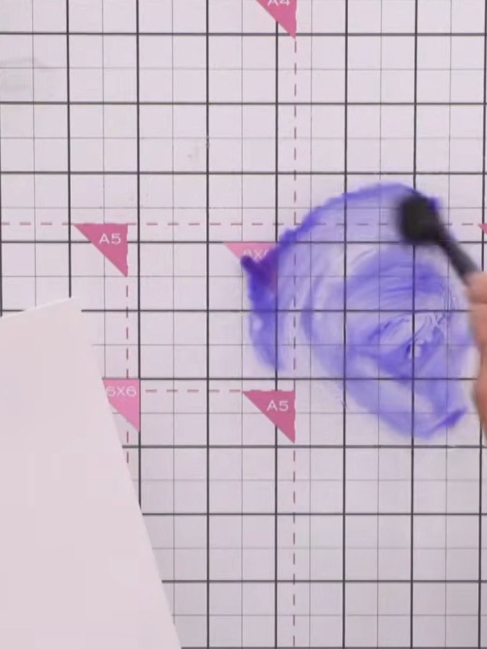 Step 4: Pick up blue paint on your brush and add it to the water puddle on your card, building up the colour to make i