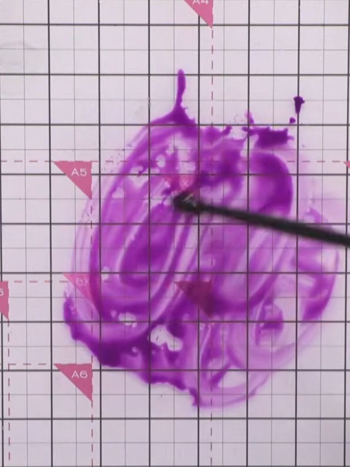 Step 8: Add more water to the purple watercolour background using a paintbrush to create an acid-like effect. Work the