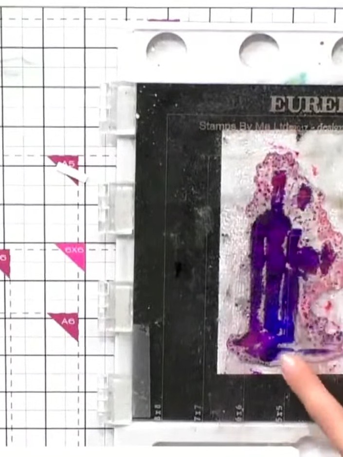 Step 2: Add multiple ink pad colours sporadically across the stamped solid portion. Try purple, blue and pink for a wa