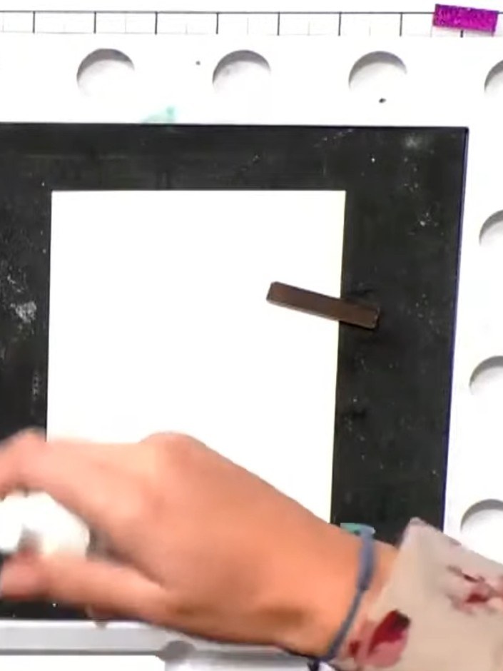 Step 2: Dust the inked stamp generously with embossing powder, ensuring complete coverage of all the stamped detail.