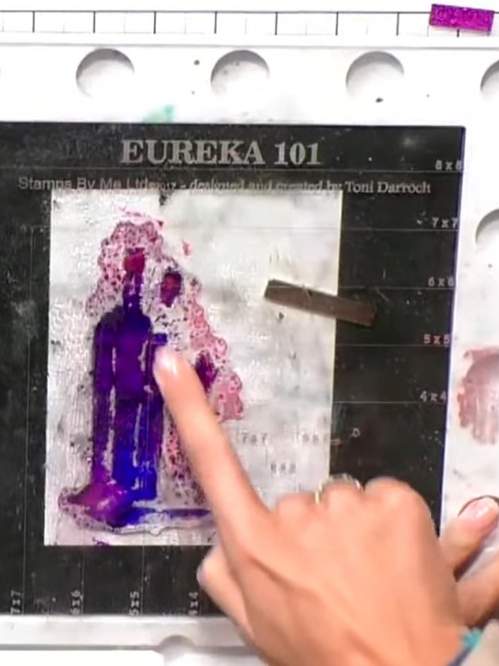 Step 4: Heat the embossing powder with a heat gun, holding it at a distance and moving it around until the powder melt