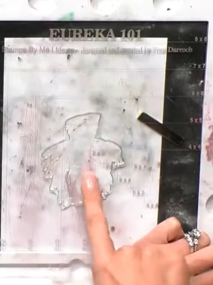 Step 2: Dust the freshly stamped image with sparkly embossing powder, ensuring the powder adheres to the wet ink. Tap 