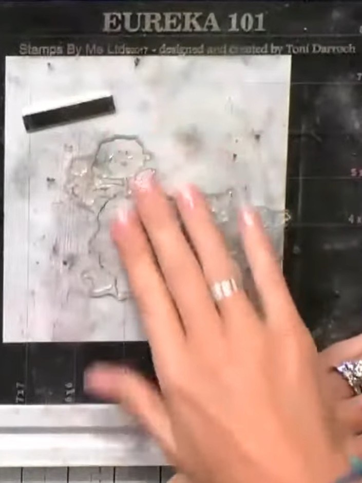 Step 4: Spritz the inked stamp with water to activate the ink and blend all the colours together, creating a watercolo